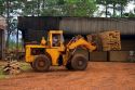 Loader moves lumber at a mill in Argentina.