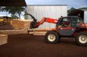 Loader moving lumber in a saw mill in Argentina.