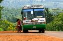 A bus stops for passengers on a rural road in Argentina.