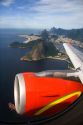 View of Rio de Janeiro and jet engine from an airliner in Brazil.