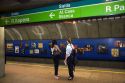 Women wait underground for the train at a subway station in Sao Paulo, Brazil where many stations display works of art.