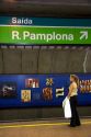 A woman waiting underground for the train at a subway station in Sao Paulo, Brazil where many stations display works of art.