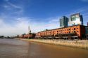 Modern office buildings and older red brick building at Puerto Modero in Buenos Aires, Argentina.