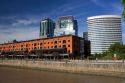 Modern office buildings and older red brick building at Puerto Modero in Buenos Aires,  Argentina.