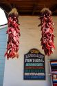 Dried chili peppers hang from a store front at Old Town, San Diego, California.