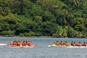 Tahitians take part in an outrigger canoe pirogue race off the island of Moorea.