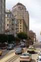California Street scene with traffic and cable car in San Francisco, California.