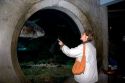Visitor looking at fish in the Monterey Bay Aquarium at Monterey, California.