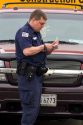 Police officer writing parking tickets in Washington, D.C.