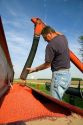 Farmer loading a planter with soy bean seeds near Defiance, Ohio.