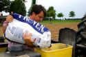 A farmer loading soy bean seeds into a planter in the east central delta region of Arkansas.