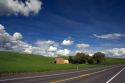 Eastern washington wheat farm with rolling hills and clouds.