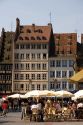 People gather in Cathedral Plaza and outdoor cafe at Strasbourg, France.