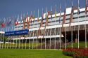 Council of Europe building and flags of member nations in Strasbourg, France.