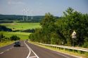 Electricity wind generators and automobiles traveling on the highway in northwest Germany.
