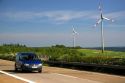 Electricity wind generators and automobiles traveling on the highway in northwest Germany.