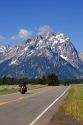 Vehicles travel on the highway through Grand Teton National Park, Wyoming.