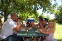 Family having a picnic lunch in the park. MR