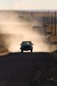 Pick up truck on dusty rural road near Pendleton, Oregon.
