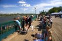 People hang out on the boardwalk in front of the Chateau Frontenac at Quebec City, Quebec, Canada.