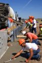 Highway construction crew installing a guardrail and laying concrete on I-80 and I-76 near Big Springs, Nebraska.