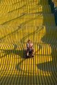 Mother and daughter ride down a giant yellow slide at the Iowa state fair in Des Moines.