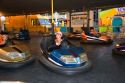 Children and adults ride bumper cars at the Iowa state fair in Des Moines.