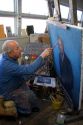 An artist painting a portrait on canvas in Boise, Idaho. MR
