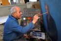 An artist paints a portrait on canvas in Boise, Idaho. MR
