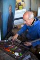 An artist painting a portrait on canvas in Boise, Idaho. MR