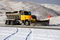 A snow plow removing snow from the road near Boise, Idaho.
