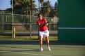 Young asian hawaiian girl playing tennis on the island of Maui, Hawaii.