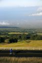 Tourists ride bicycles along the Mount Haleakala road on the island of Maui, Hawaii.