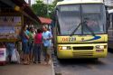 People wait at a bus stop in Manaus, Brazil.