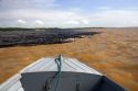 The bow of a boat at the confluence of the Amazon River and the Rio Negro at Manaus, Brazil.