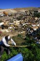 Man dumping yard waste at a landfill in Boise, Idaho.