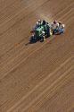 Aerial view of a farmer on a tractor planting seed in Canyon County, Idaho.