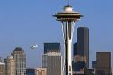 Sea plane flying over the city of Seattle and the Space Needle in Washington.