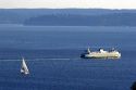 Washington State Ferry Boat and sail boat in Elliott Bay at Seattle, Washington.