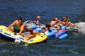 People on inflatable rafts floating the Boise River in Boise, Idaho.