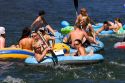People on inflatable rafts floating the Boise River in Boise, Idaho.