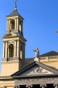 Steeple and jesus atop the Mozes en Aaronkerk Church in the Waterloo Plein area of Amsterdam, Netherlands.