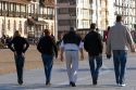 People walk on the promenade at Nieuwpoort in the province of West Flanders, Belgium.