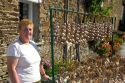 French woman selling garlic at Saint-Broladre in the  Brittany  province of France.