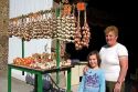 French woman selling garlic at Saint-Broladre in the  Brittany  province of France.