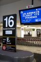Spanish and English language signs above a baggage conveyor in the Mexico City International Airport, Mexico.