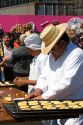 Bread being made into the shape of a skull to celebrate the Day of the Dead in the Zocalo in Mexico City, Mexico.