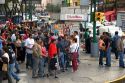 Pedestrians at the intersection of Paseo de la Reforma and Eje Central Lazaro Cardenas in Mexico City, Mexico.