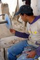 A Mexican artisan making a mask from obsidian near Teotihuacan in the State of Mexico, Mexico.