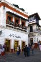 People and storefronts in the plaza at Taxco in the State of Guerrero, Mexico.
